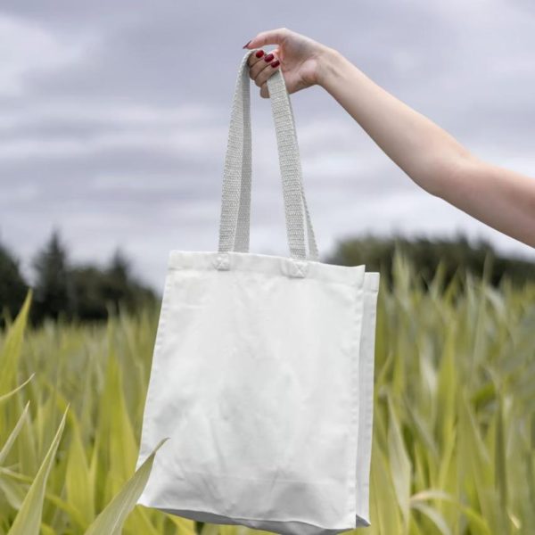Blank Canvas in Hand Mockup
