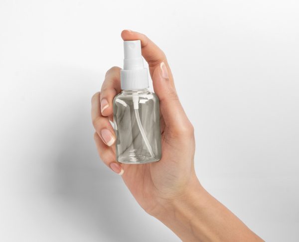 Blank Spray Bottle in hand Mockup