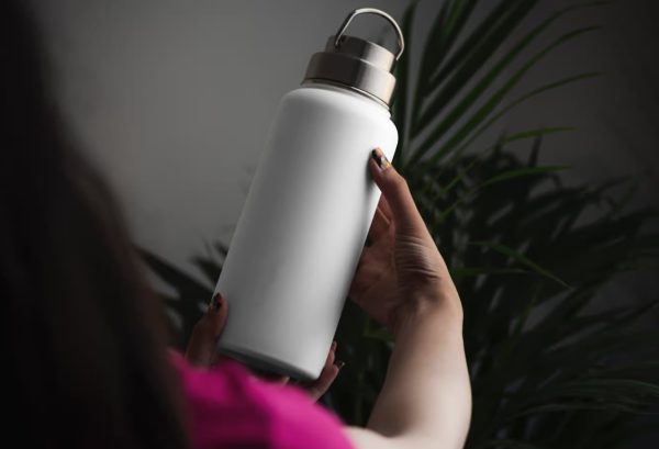 Blank Water Bottle in Hand Mockup