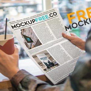 In Hand Newspaper Mockup PSD
