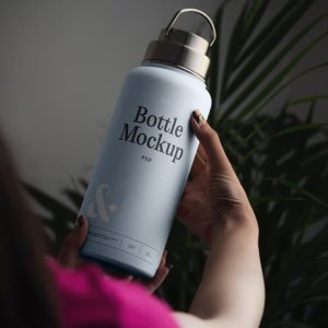 Women Holding Bottle in Hand Mockup
