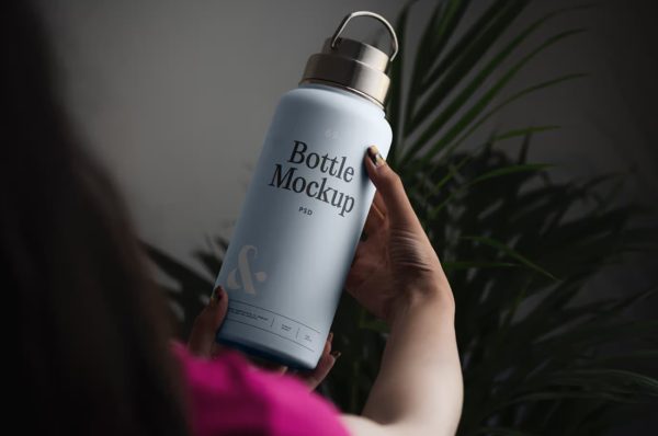 Women Holding Bottle in Hand Mockup